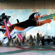 Illustration for article titled Every Single Mural in the World Should Be of Colossal Cats Shooting Lasers